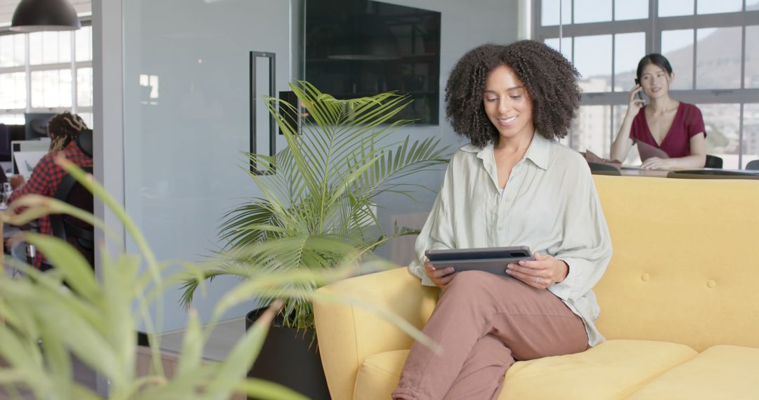 Businesswoman Using Tablet in Modern Office Space