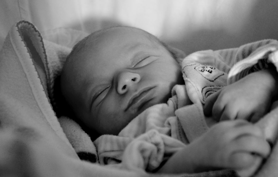 Peacefully Sleeping Newborn Baby in Black and White - Free Images, Stock Photos and Pictures on Pikwizard.com