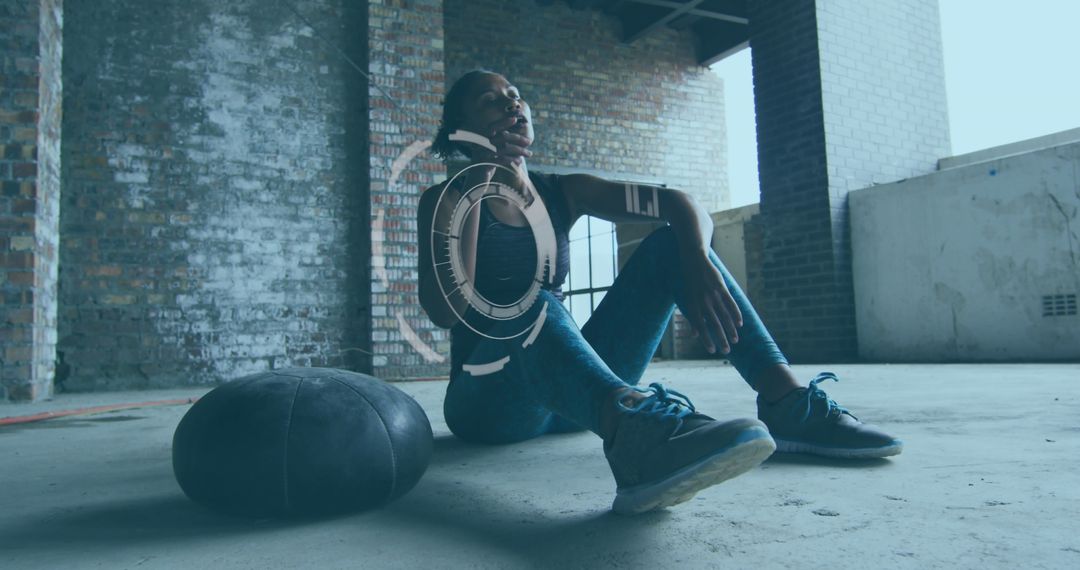 Athletic Woman Resting in Urban Abandoned Building with Digital Interface