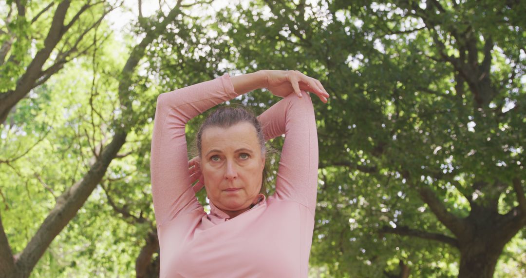 Senior Woman Engaging in Outdoor Stretching Exercise - Free Images, Stock Photos and Pictures on Pikwizard.com