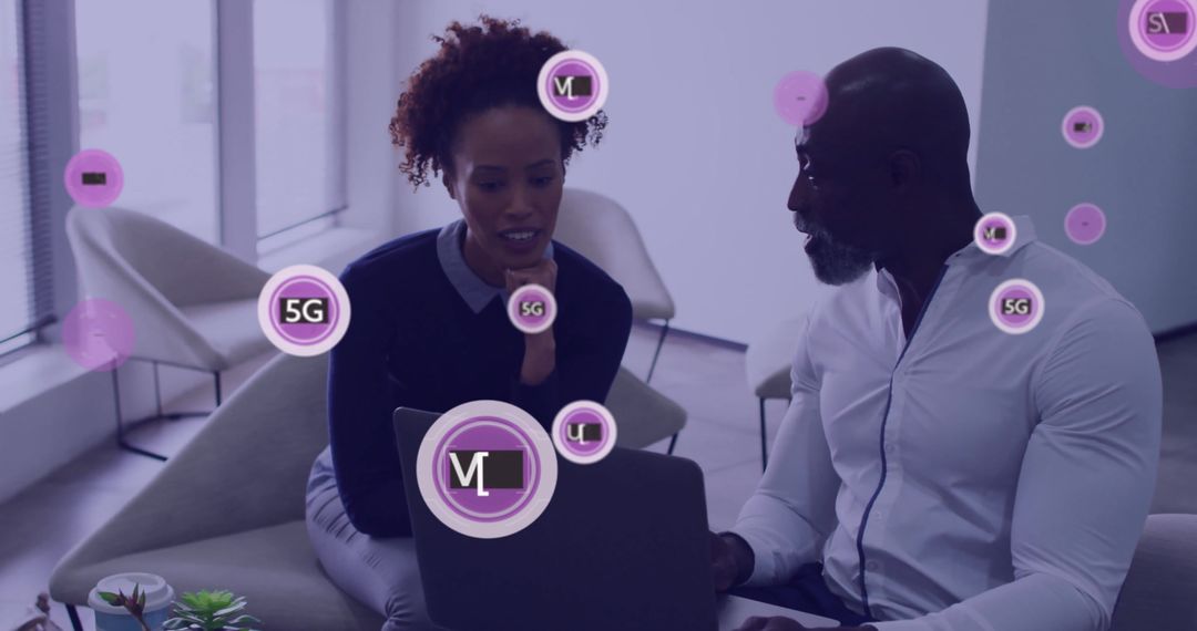 Colleagues Discussing Next-Gen Network Technology in Modern Office