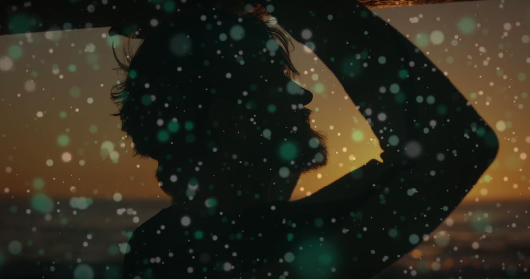 Silhouette of Man at Beach Contemplating Digital Interface