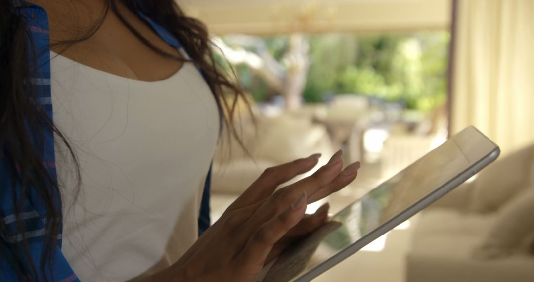 Woman Using Tablet in Modern Home Interior - Free Images, Stock Photos and Pictures on Pikwizard.com