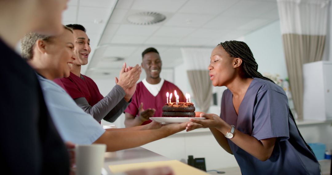 Healthcare Workers Celebrating Birthday with Cake in Hospital Ward - Free Images, Stock Photos and Pictures on Pikwizard.com