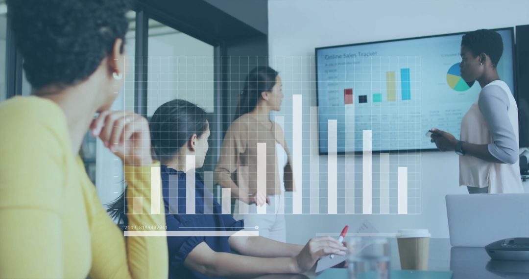 Diverse Business Team Analyzing Digital Sales Data in Meeting