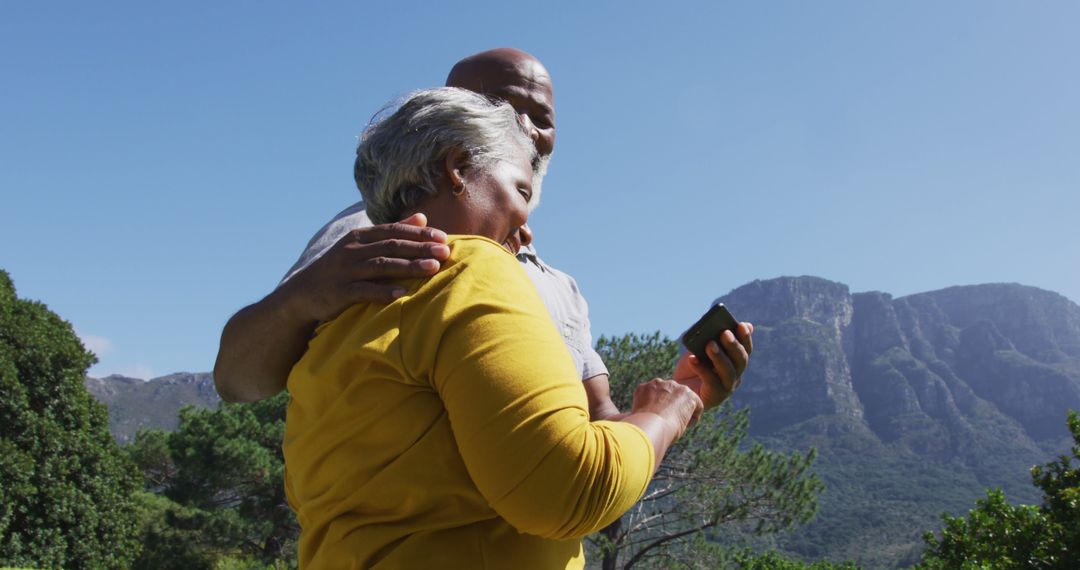 Happy Senior Couple Taking Selfie in Sunny Garden