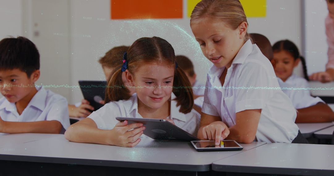 School Kids Engaged in Learning with Tablets and Interactive Technology