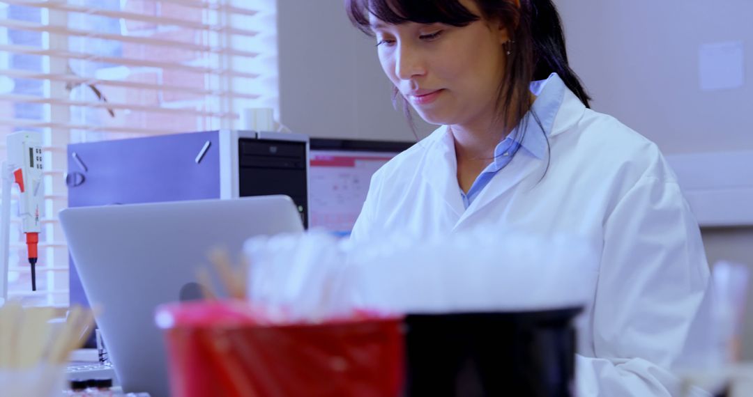 Female Scientist Working in Laboratory on Laptop - Free Images, Stock Photos and Pictures on Pikwizard.com