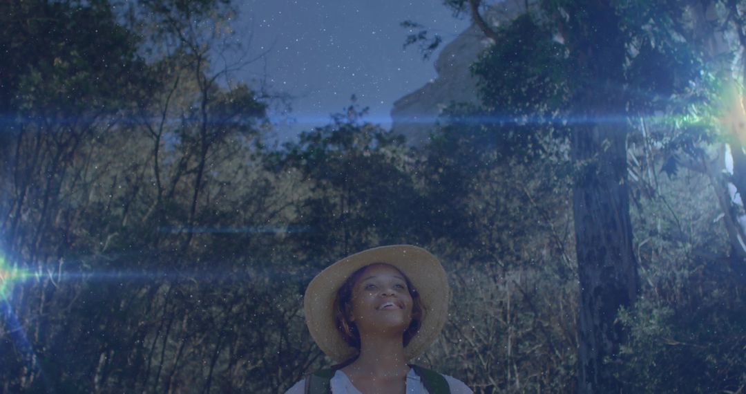 Female Hiker Embracing Serenity Under Night Sky in Forest