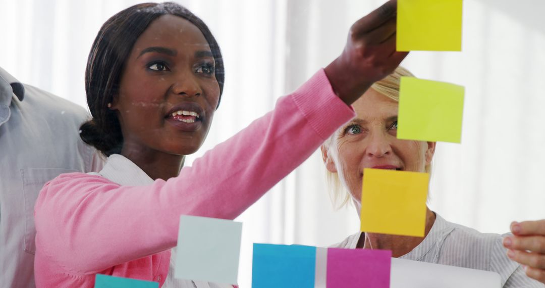 Diverse Colleagues Strategy Meeting with Colorful Sticky Notes