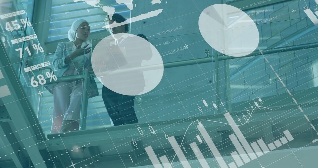 Business Professionals Discussing Technology in Modern Atrium