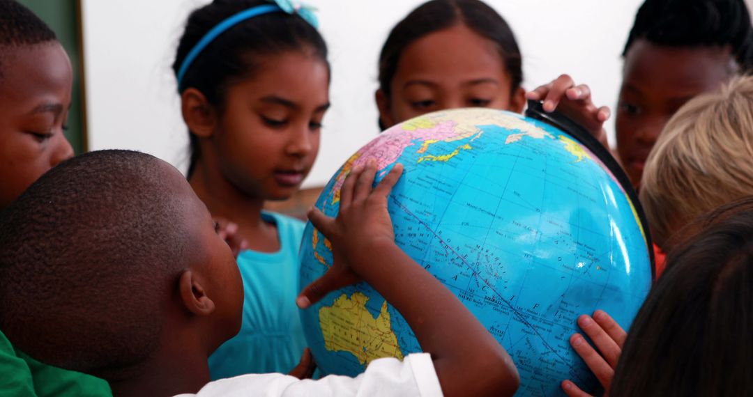 Curious Students Exploring World Map on Classroom Globe
