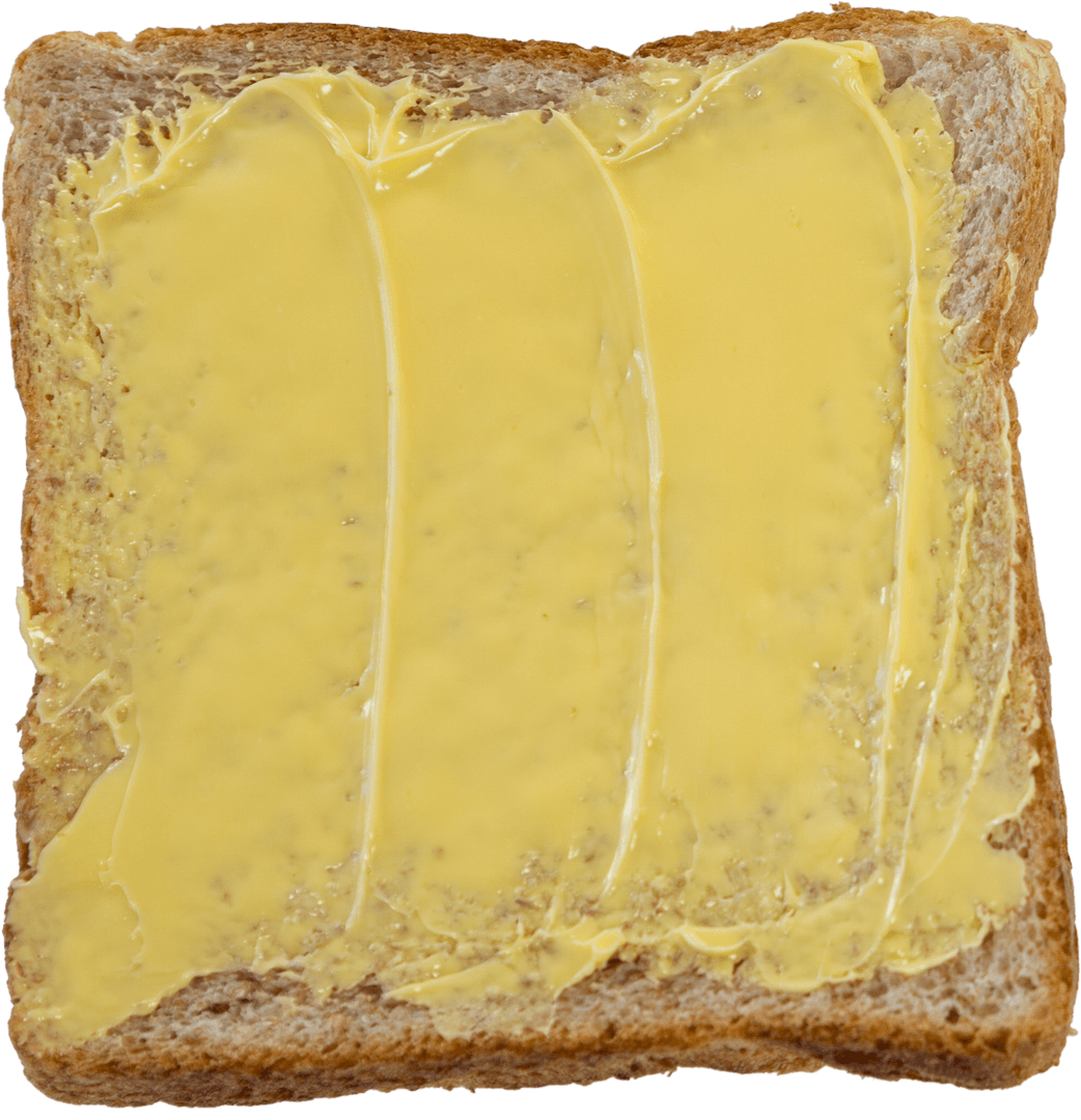 Close-Up of Transparent Spreadable Butter on Whole Wheat Bread Slice