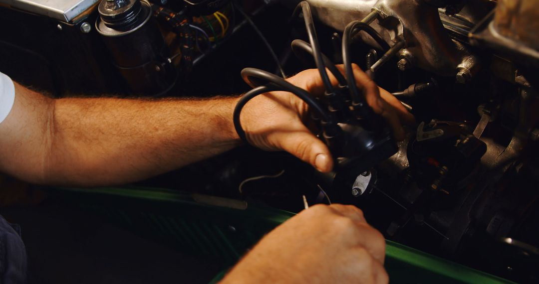 Skilled Mechanic Hands Repairing Engine in Workshop - Free Images, Stock Photos and Pictures on Pikwizard.com