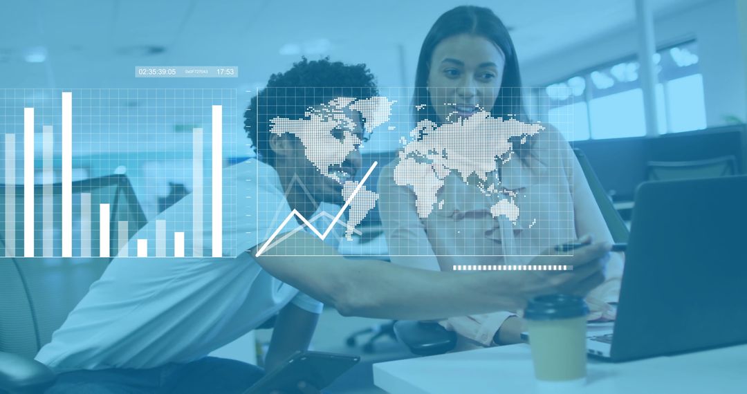 Colleagues Analyzing Business Data on Laptop in Modern Office