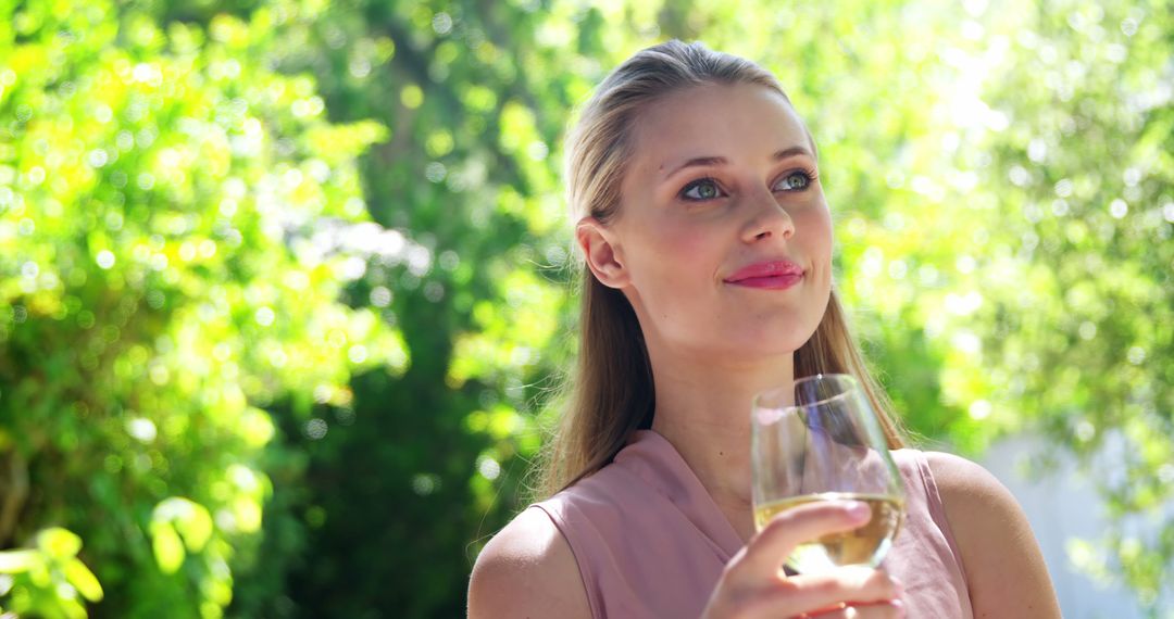 Woman Enjoying Wine in Garden on Bright Sunny Day - Free Images, Stock Photos and Pictures on Pikwizard.com