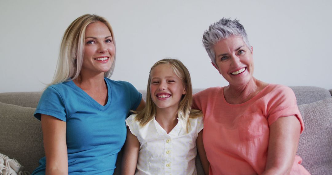 Three Generations of Women Smiling Together on Couch - Free Images, Stock Photos and Pictures on Pikwizard.com