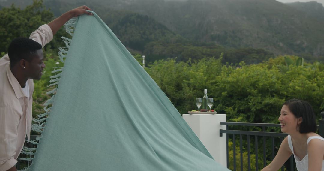 Couple preparing patio for outdoor celebration event