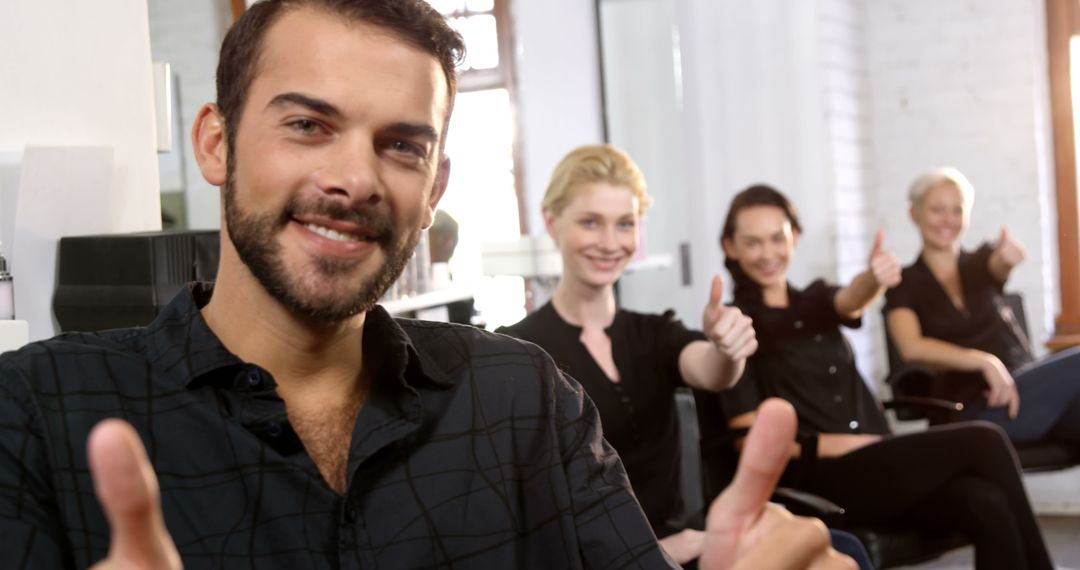 Casual Office Team Giving Thumbs Up in Collaborative Environment