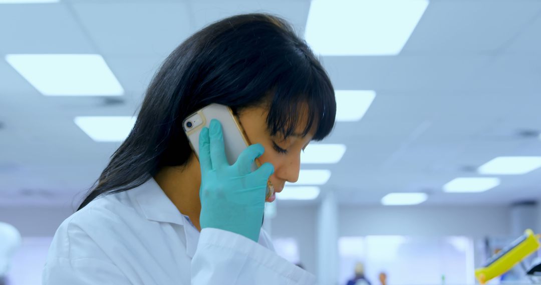 Female Scientist on Phone in Laboratory - Free Images, Stock Photos and Pictures on Pikwizard.com