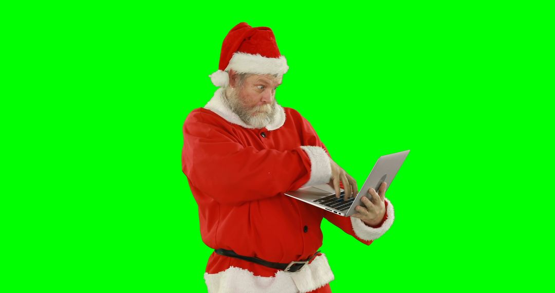 Santa Claus Using Laptop Isolated on Green Chroma Key Background - Free Images, Stock Photos and Pictures on Pikwizard.com