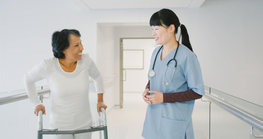 Nurse Assisting Senior Woman with Walker in Bright Hallway - Free Images, Stock Photos and Pictures on Pikwizard.com