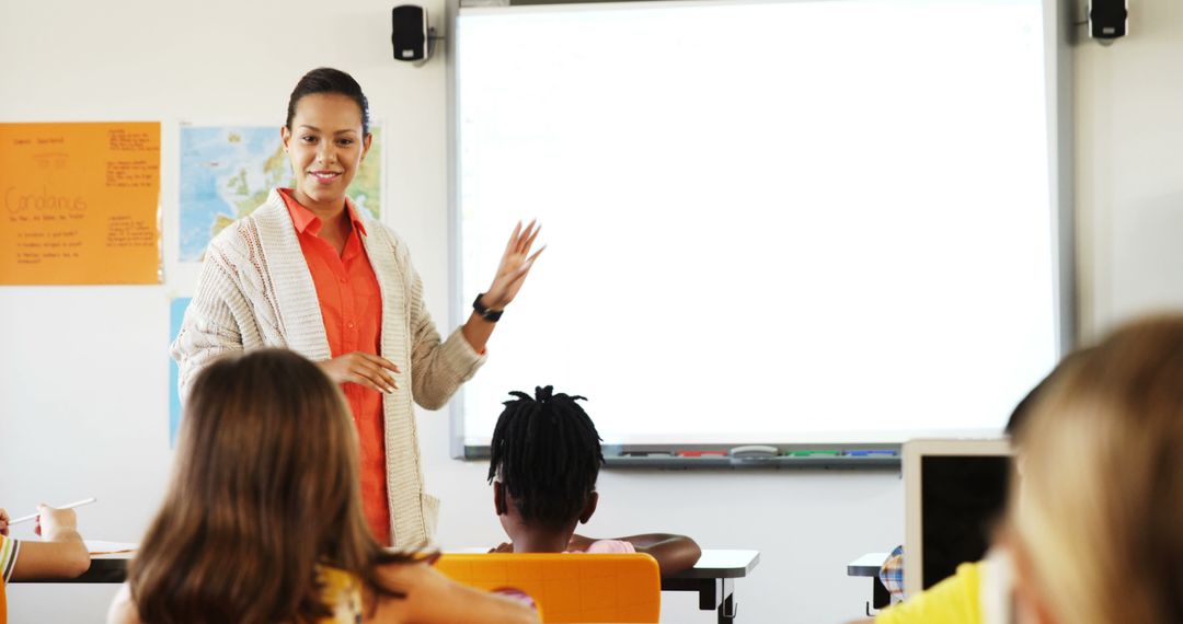 Female Teacher Using Whiteboard in Classroom as Students Engage - Free Images, Stock Photos and Pictures on Pikwizard.com