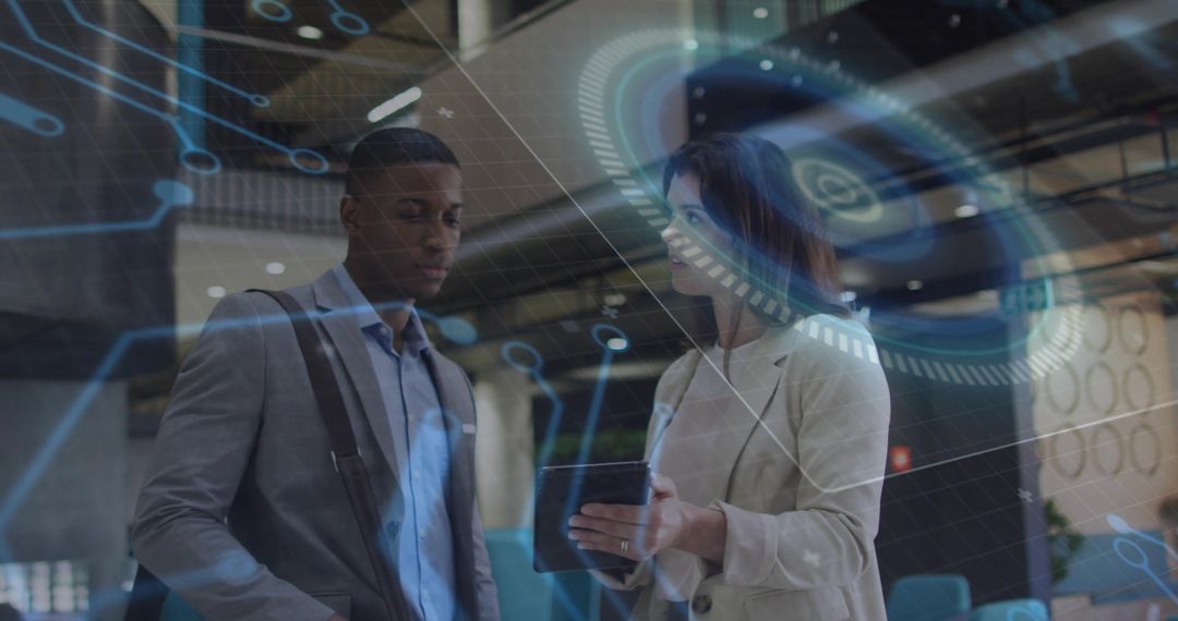 Business colleagues collaborating with tablet and futuristic HUD overlay in office atrium