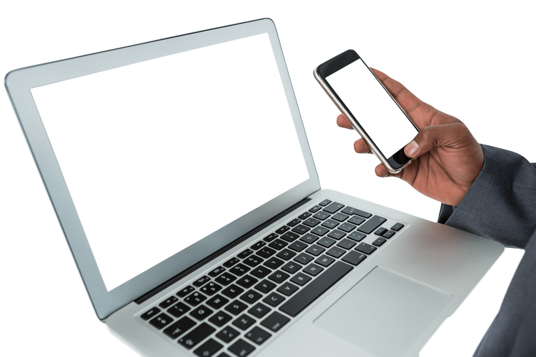 Businessman Interacting with Transparent Laptop and Mobile