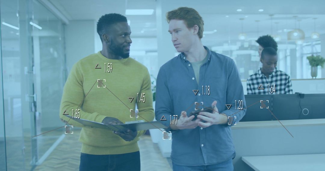 Multiracial Colleagues Discuss Team Project in Modern Office Environment