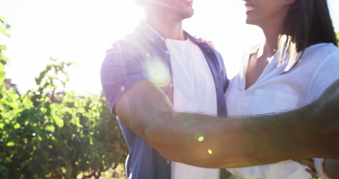 A young Caucasian couple enjoys a romantic moment in bright sunlight, with copy space - Free Images, Stock Photos and Pictures on Pikwizard.com