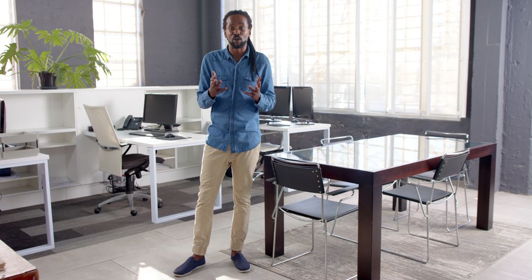 Confident Businessman Presenting in Modern Office Setting