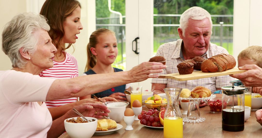 Multi-Generational Family Enjoying Breakfast Together at Home - Free Images, Stock Photos and Pictures on Pikwizard.com