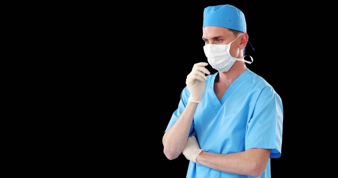 Male Surgeon Wearing Scrubs and Mask with Thoughtful Expression - Free Images, Stock Photos and Pictures on Pikwizard.com