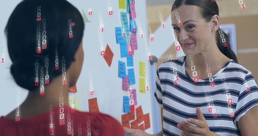 Binary Code Overlay on Business Colleagues Brainstorming Ideas