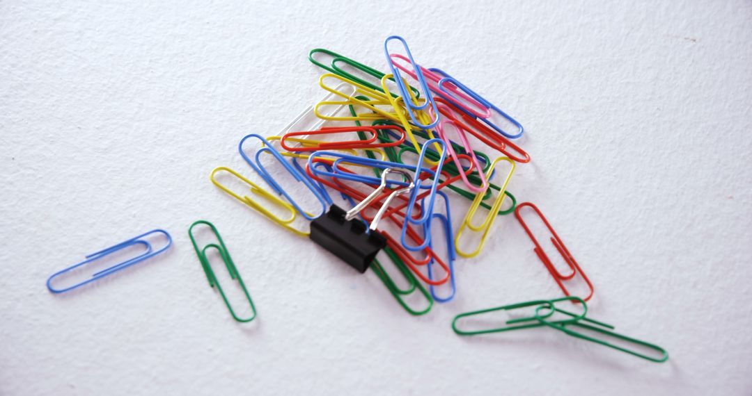 Colorful Paper Clips and Binder Clip on White Background - Free Images, Stock Photos and Pictures on Pikwizard.com