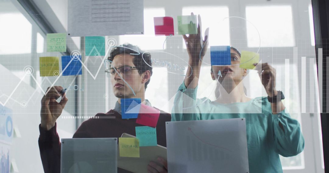 Team Collaborating on Digital Strategy with Sticky Notes and Data Visuals