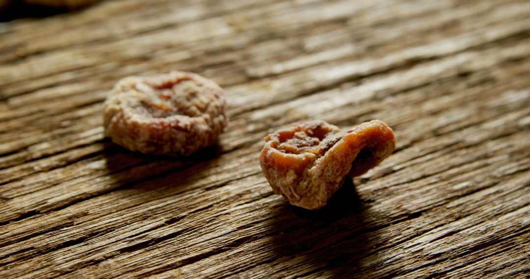 Close-up of Dried Fruit Pieces on Wooden Surface - Free Images, Stock Photos and Pictures on Pikwizard.com