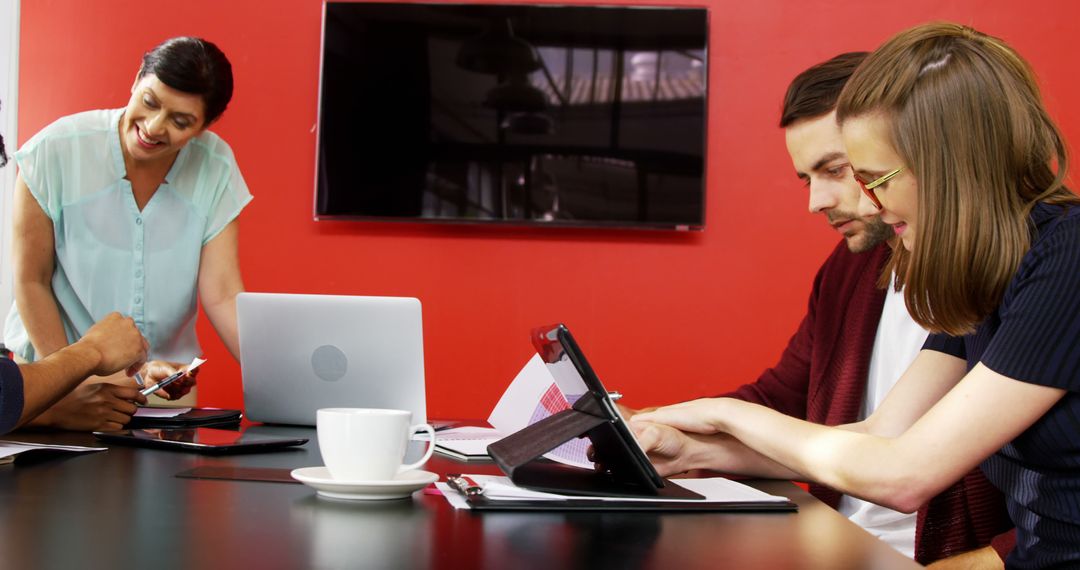 Team Collaborating in Modern Office Meeting Room