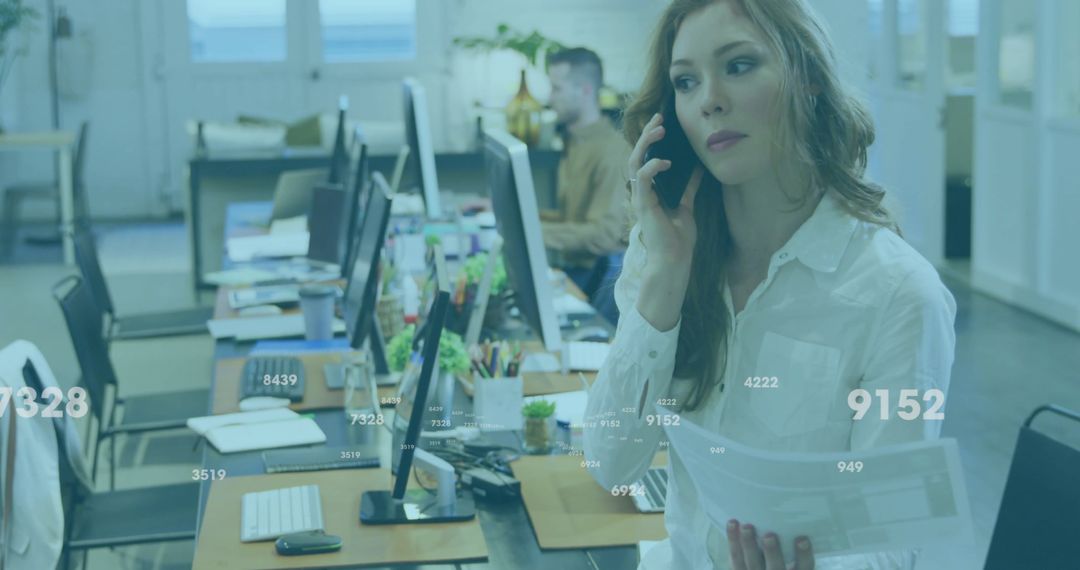 Businesswoman Conversing on Phone with Data Analytics Overlay in Office