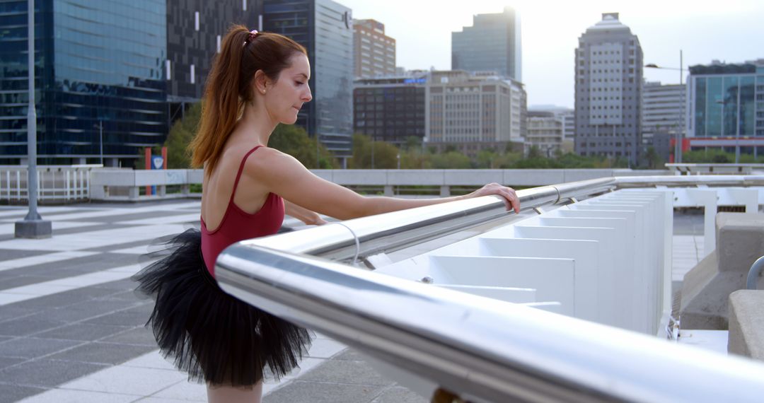 Ballerina Practicing Ballet Moves on Urban City Terrace at Sunrise - Free Images, Stock Photos and Pictures on Pikwizard.com