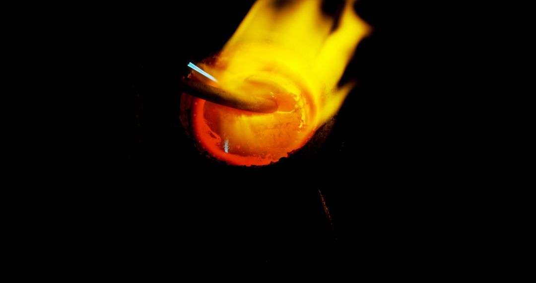 Molten Metal Pouring from Crucible in High Temperature Workshop - Free Images, Stock Photos and Pictures on Pikwizard.com