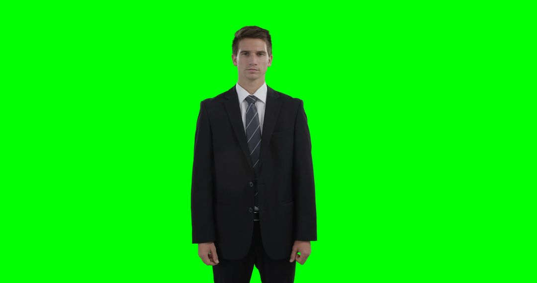 Businessman in Suit Posing against Green Screen Background - Free Images, Stock Photos and Pictures on Pikwizard.com