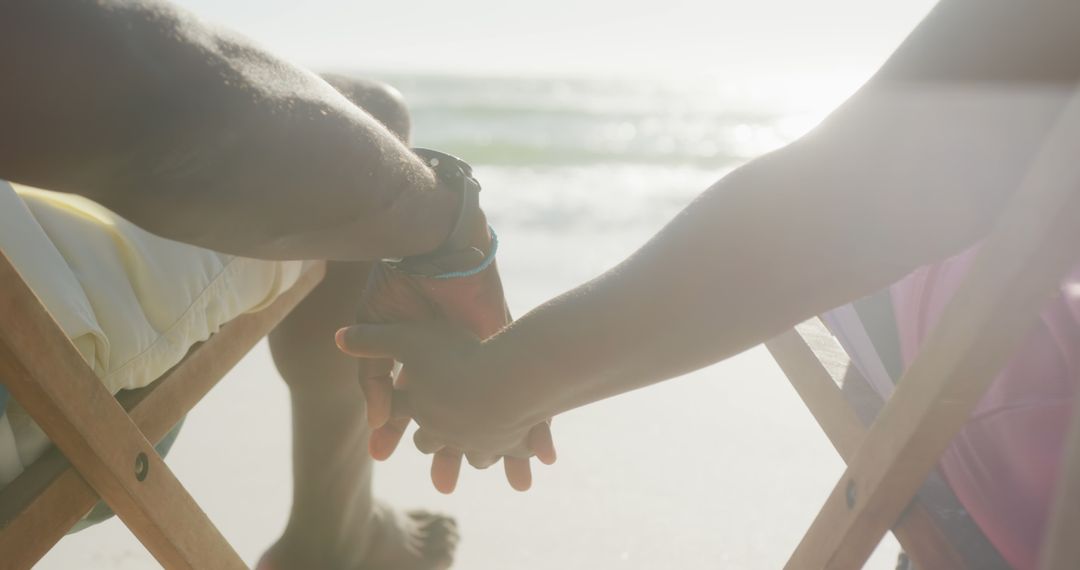 Holding Hands on Relaxing Beach Vacation at Sunset - Free Images, Stock Photos and Pictures on Pikwizard.com