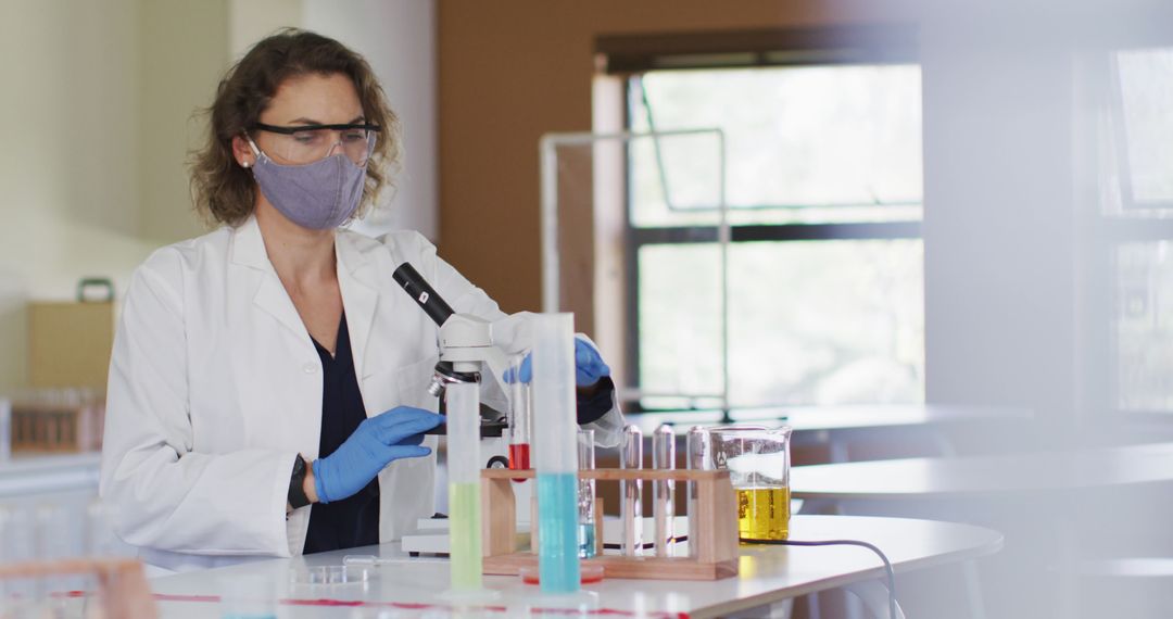 Female Scientist Working in Laboratory with Test Tubes - Free Images, Stock Photos and Pictures on Pikwizard.com