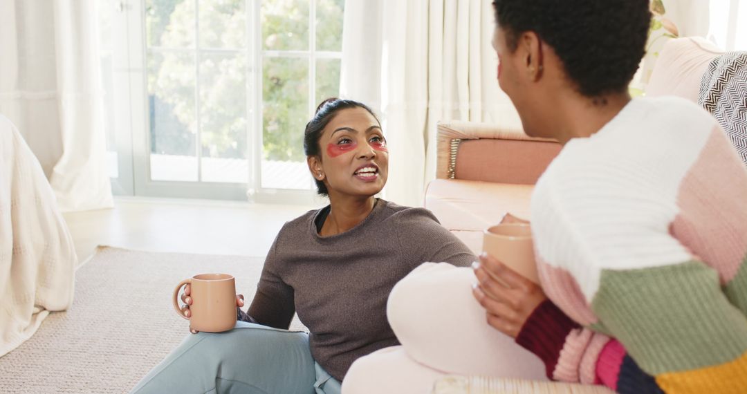Couple Relaxing at Home with Eye Patches and Warm Drinks