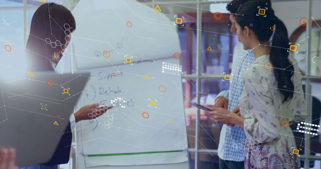 Diverse Colleagues Engaging with Digital Tech in Modern Office