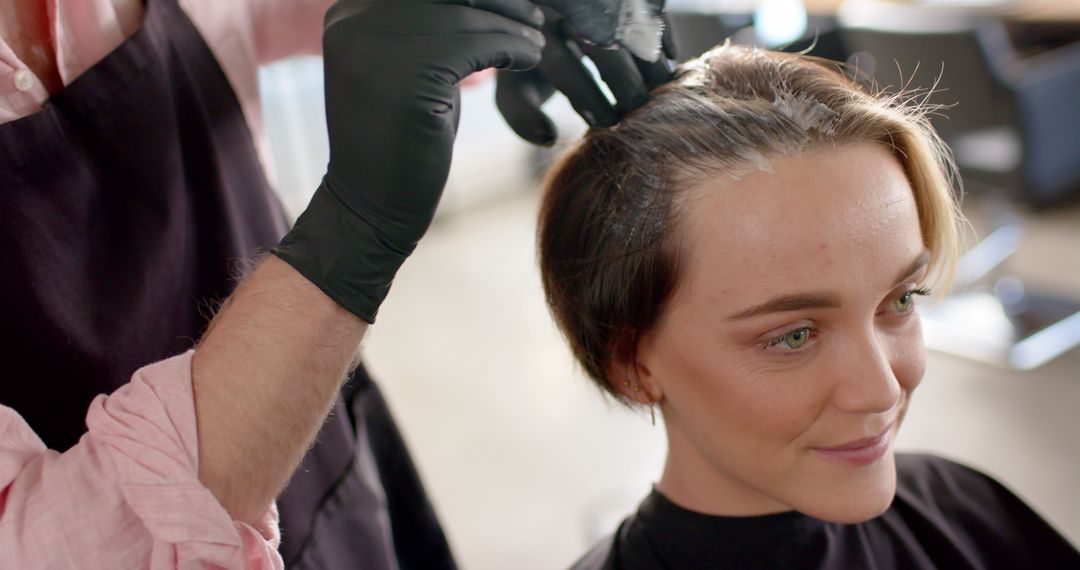 Hairdresser Applying Dye to Short Hair of Smiling Woman in Salon - Free Images, Stock Photos and Pictures on Pikwizard.com