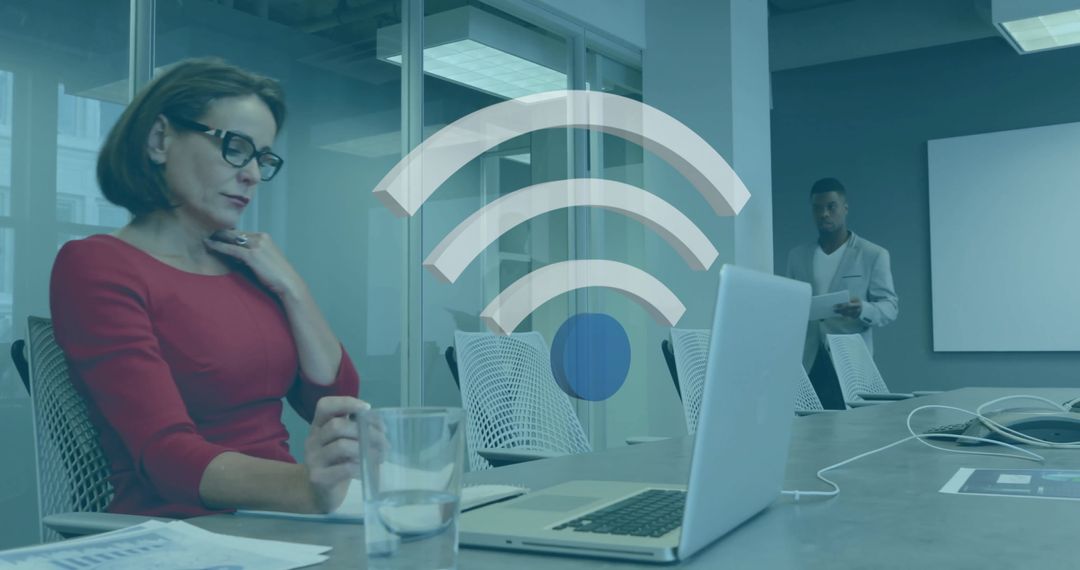 Diverse Business Team Using Technology in Modern Workspace