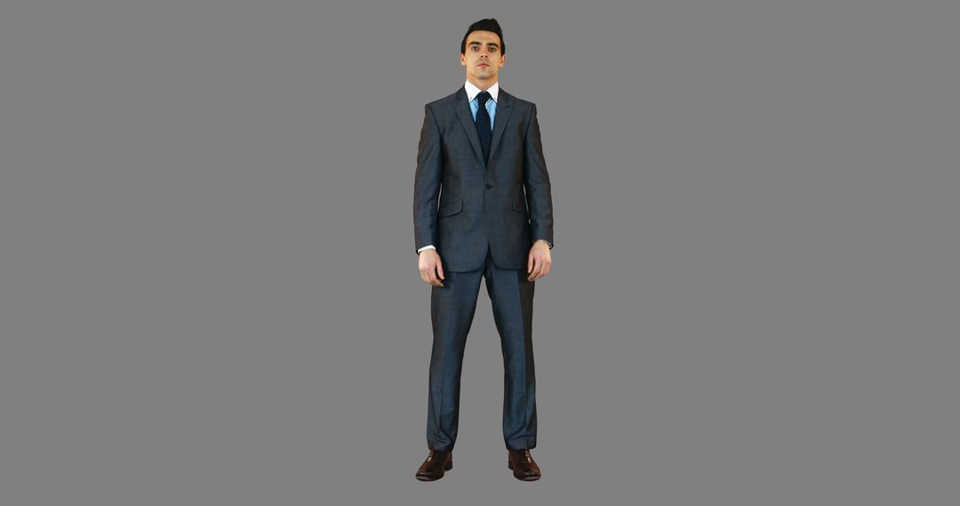 Confident Businessman in Formal Suit Standing against Gray Background - Free Images, Stock Photos and Pictures on Pikwizard.com